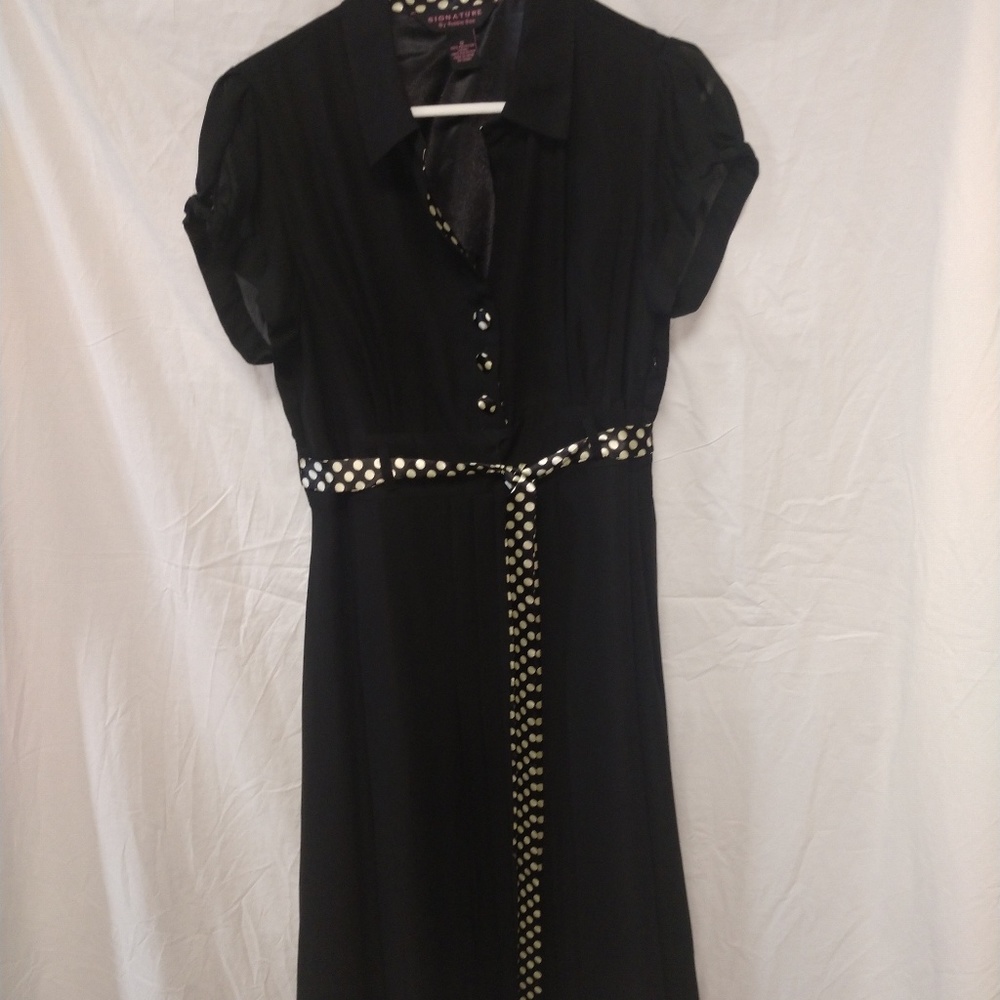 Black knee length dress.
